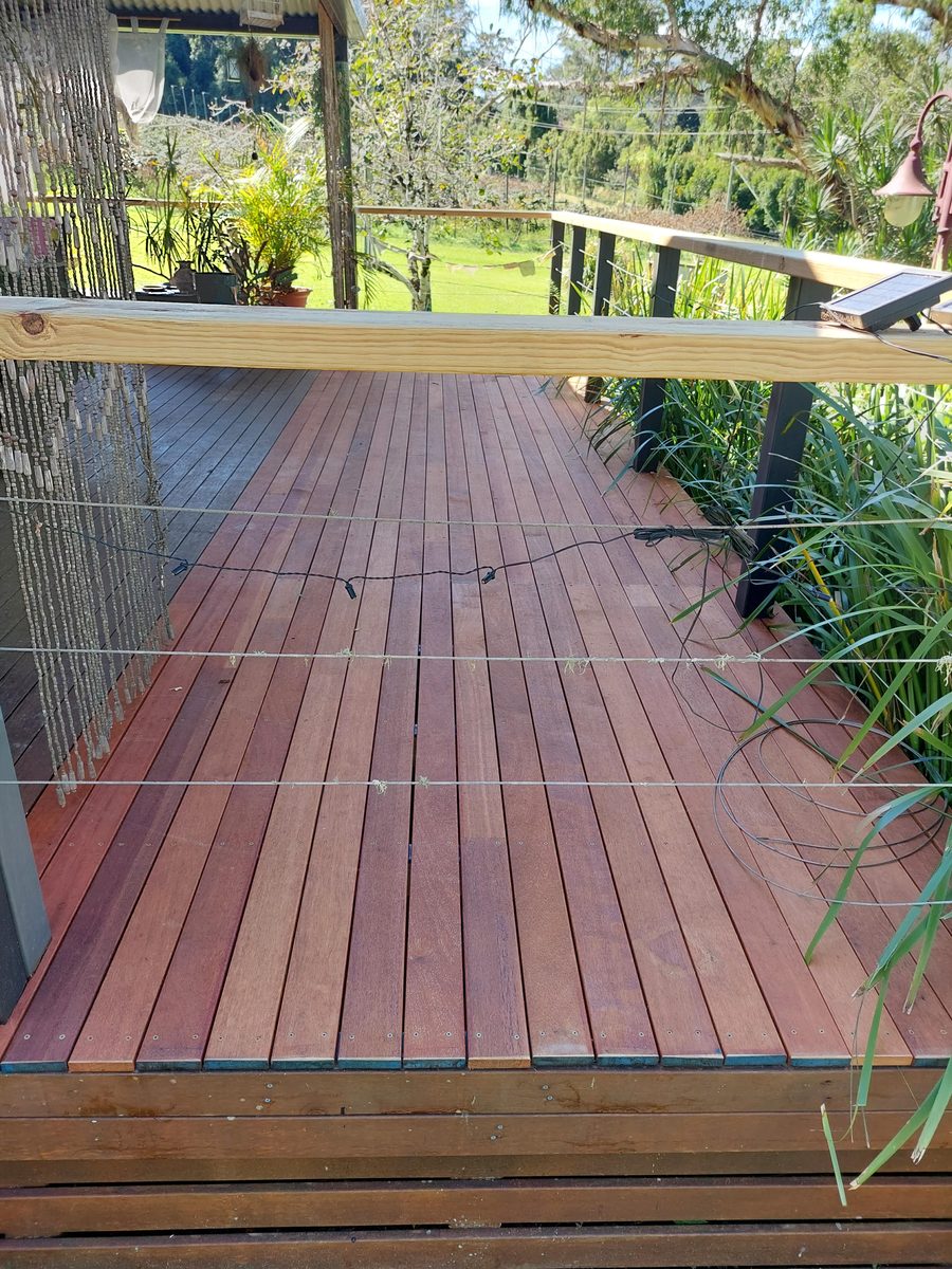 The rebuilt deck finished in new hardwood with a new handrail