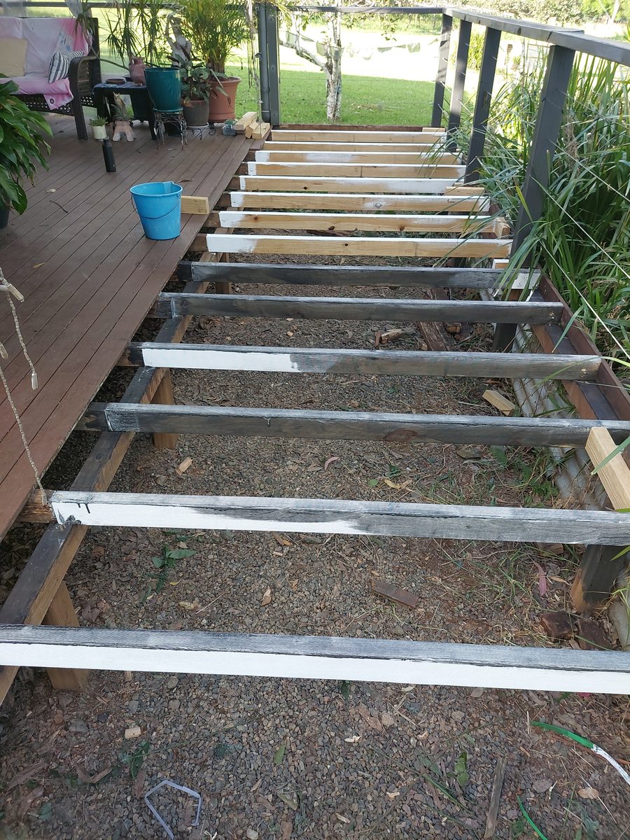 Deck stripped back to the joists mid-rebuild