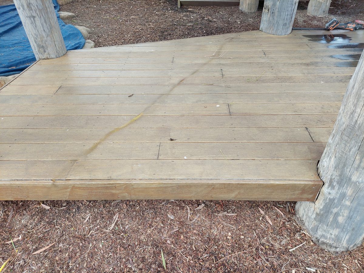 New timber deck platform built around log posts